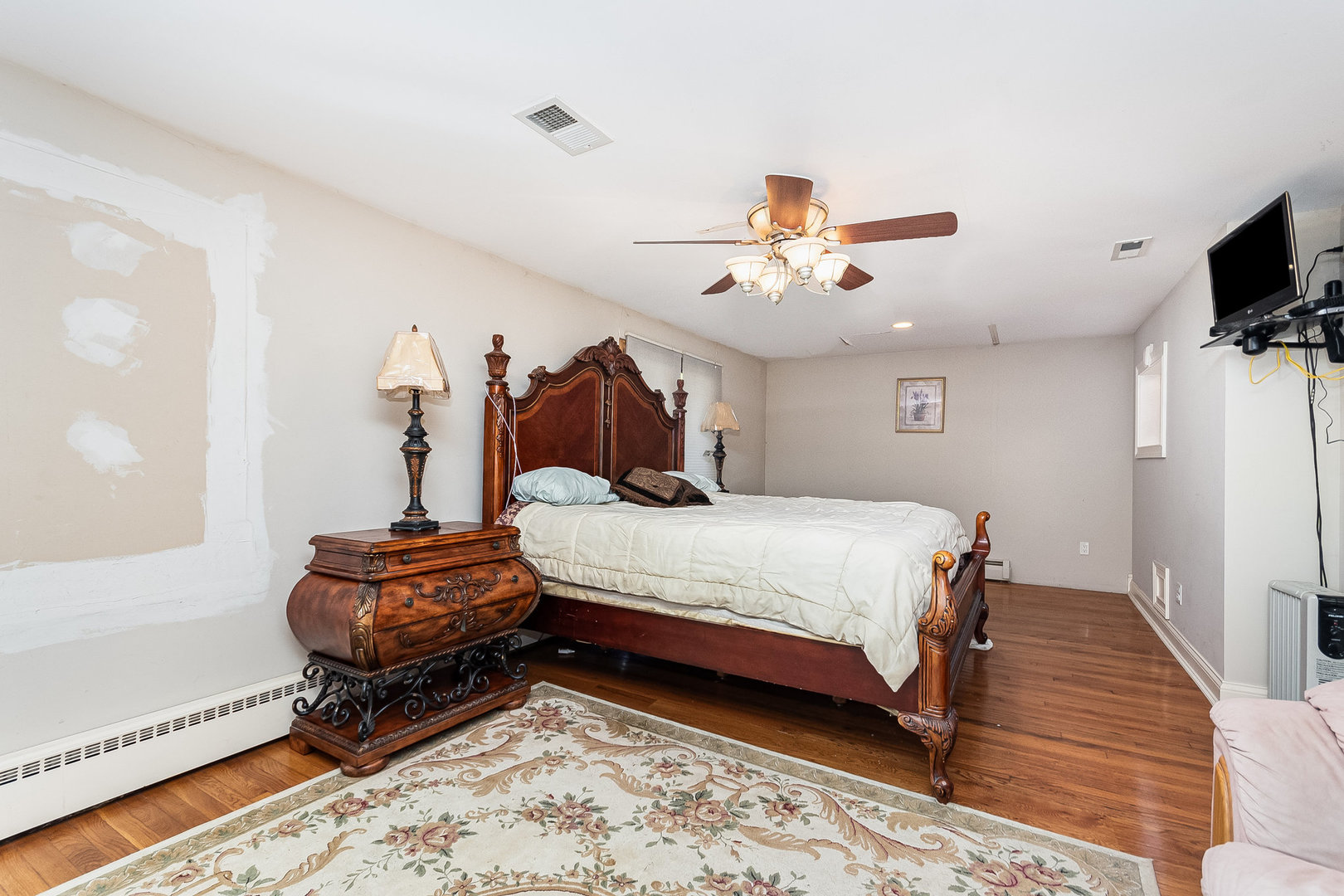 2207 Jericho Road Aurora, IL 60506 - Photo 9 of 18 a bed room with a bed and a chandelier