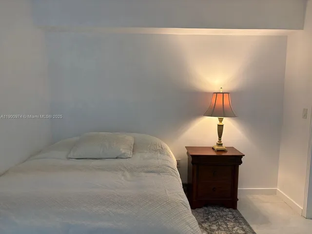 a bathroom with a sink and a lamp