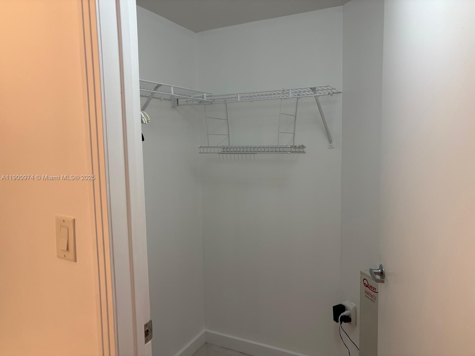 9055 Southwest 73rd Court, Unit 1806 Miami, FL 33156 - Photo 15 of 23 a bathroom with a glass shower door