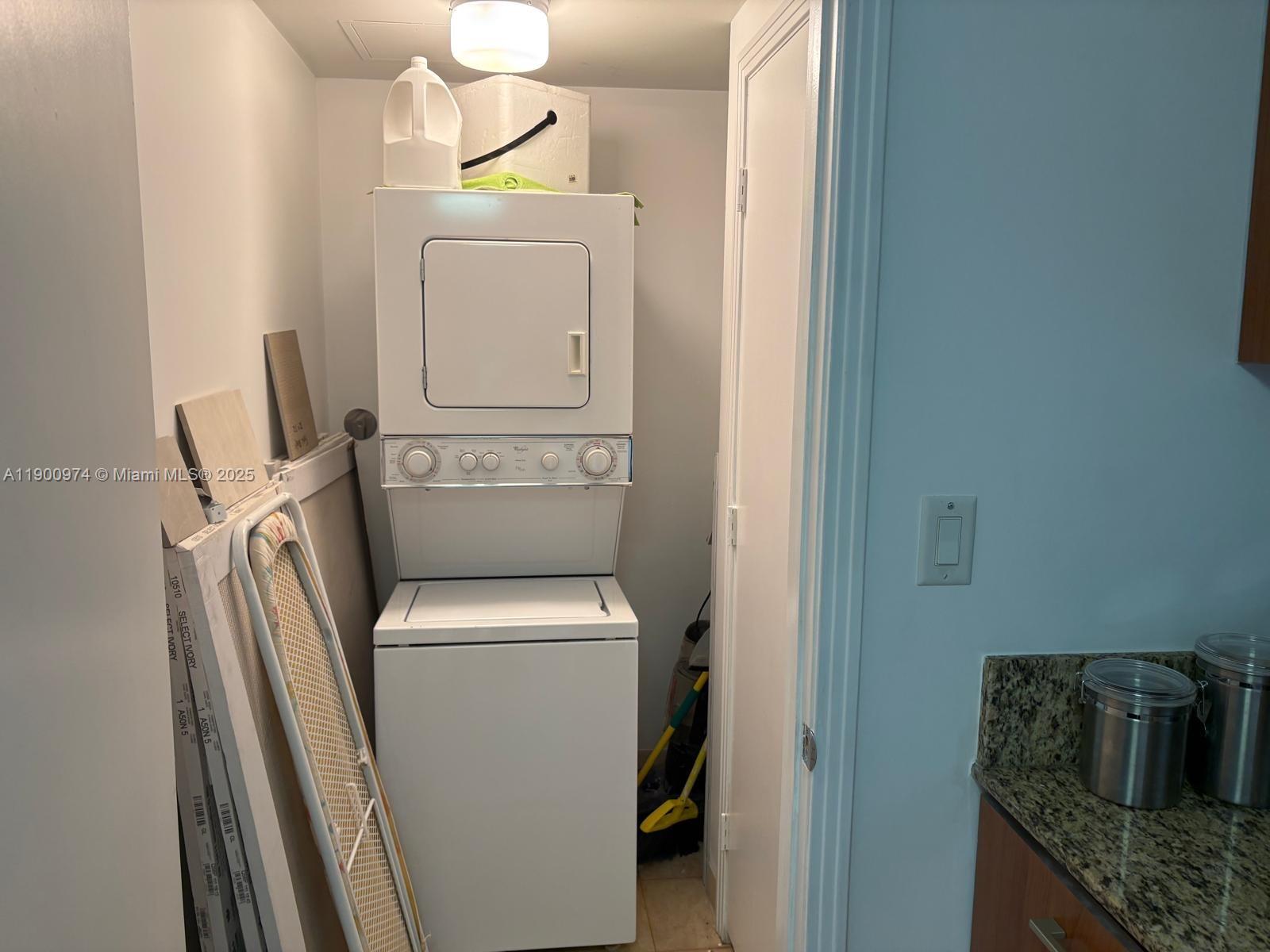 9055 Southwest 73rd Court, Unit 1806 Miami, FL 33156 - Photo 20 of 23 a utility room with dryer and washer