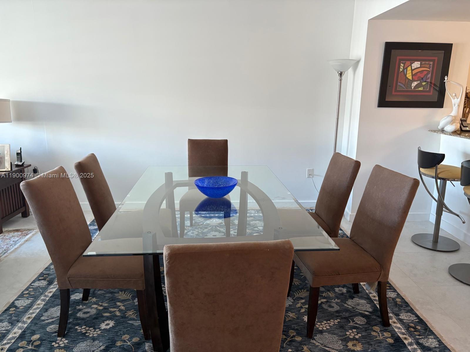 9055 Southwest 73rd Court, Unit 1806 Miami, FL 33156 - Photo 4 of 23 a view of a dining room with furniture and wooden floor