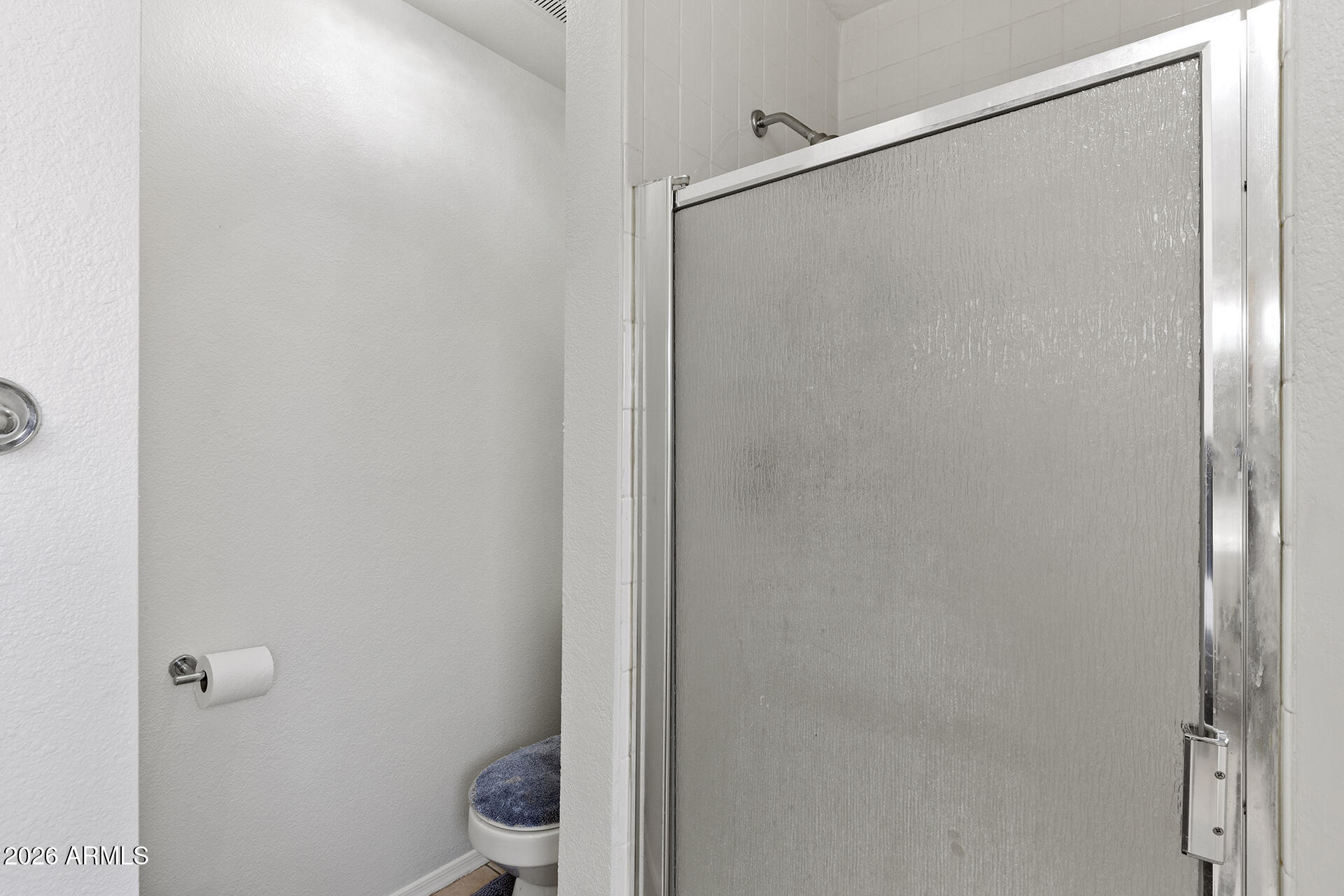 9002 West Coronado Road Phoenix, AZ 85037 - Photo 31 of 54 a bathroom with a granite countertop shower and a toilet