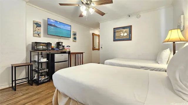 a bedroom with a bed and a lamp on table