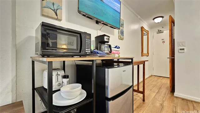 a kitchen with stainless steel appliances granite countertop a stove top oven a sink and dishwasher