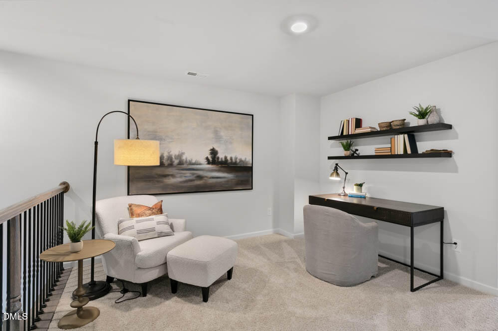 Undisclosed Address Fuquay-Varina, NC 27526 - Photo 13 of 28 a living room with furniture and a painting on the wall