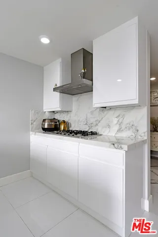 a kitchen with cabinets a sink and dishwasher