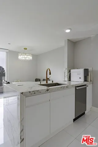 a room with a balcony a bed and a window