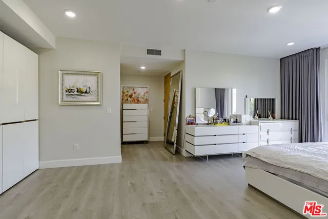 a bathroom with a shower and a glass door