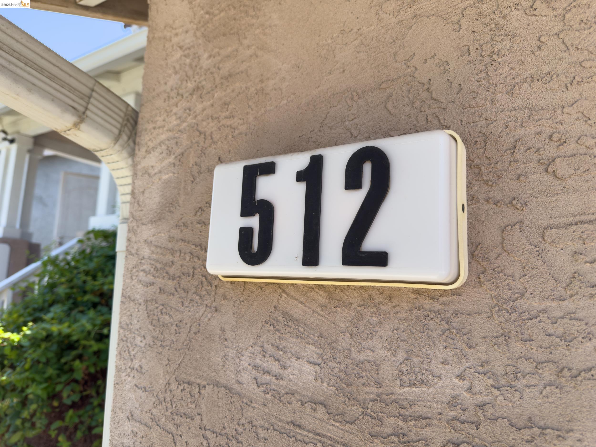 512 Burdick Drive Bay Point, CA 94565 - Photo 4 of 50 Illuminated address numbering featuring large, legible numerals on a stucco exterior