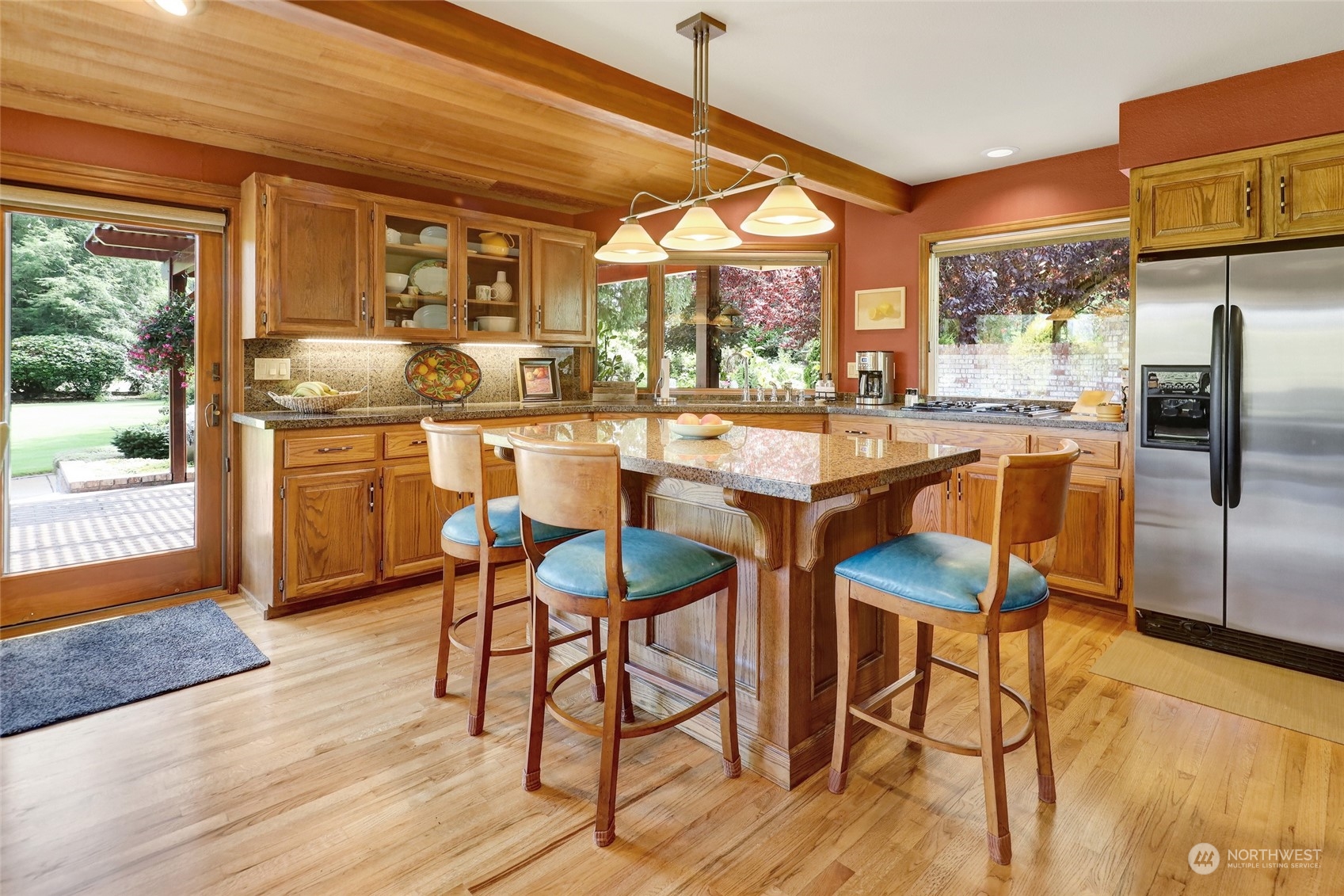 1261 Central Road Everson, WA 98247 - Photo 11 of 40 a kitchen with stainless steel appliances granite countertop table chairs and wooden floor