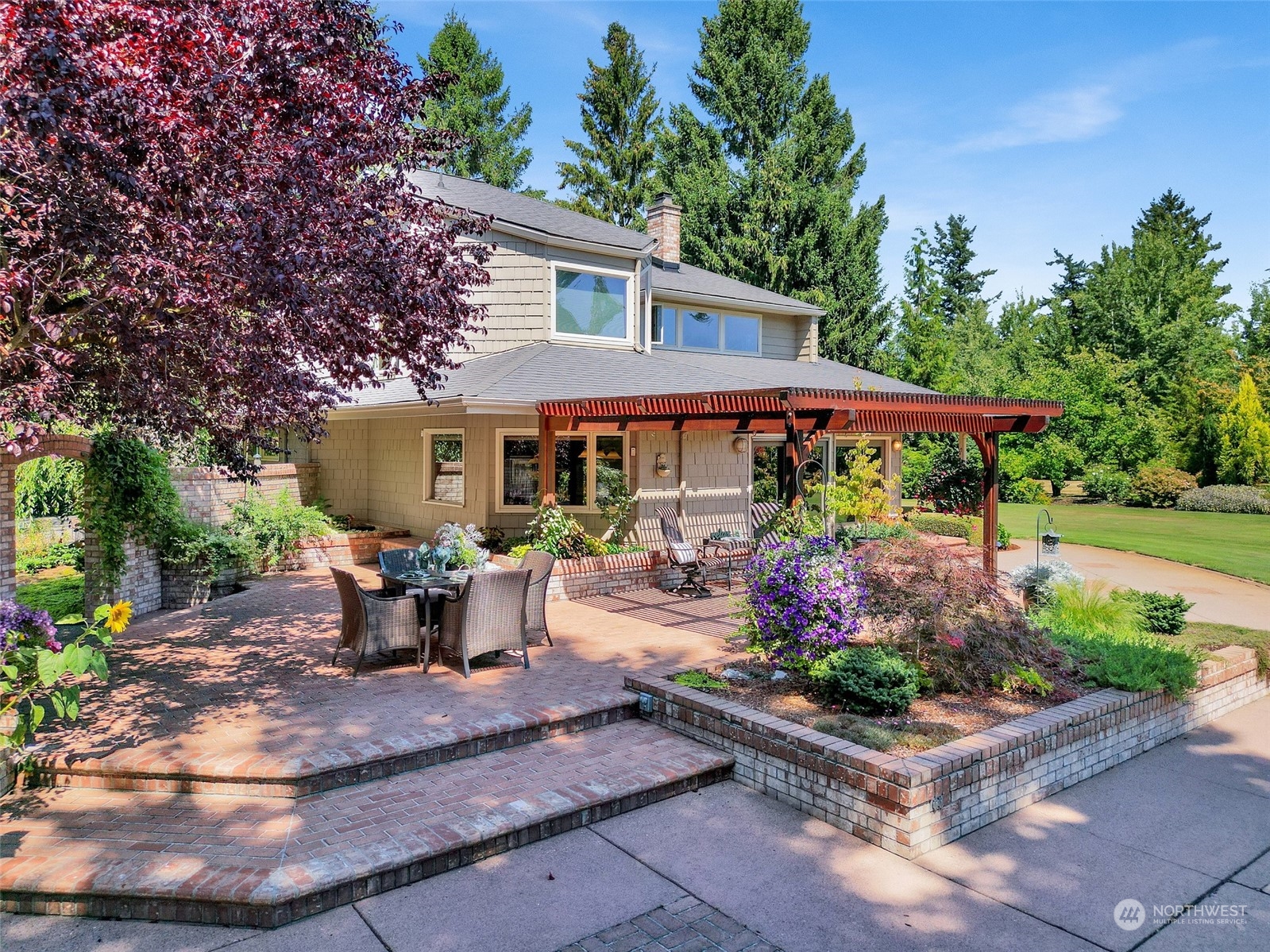 1261 Central Road Everson, WA 98247 - Photo 34 of 40 a view of a house with sitting area and garden