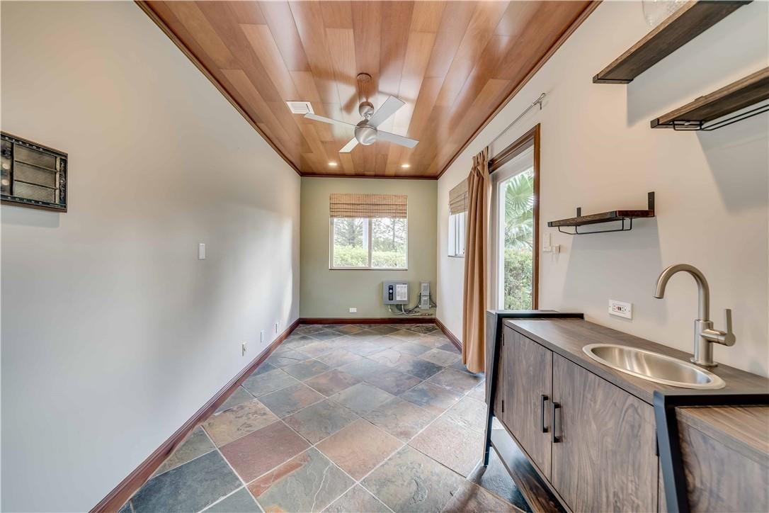 1920 Southwest 67th Terrace Plantation, FL 33317 - Photo 36 of 65 a view of a kitchen with a sink and a large window