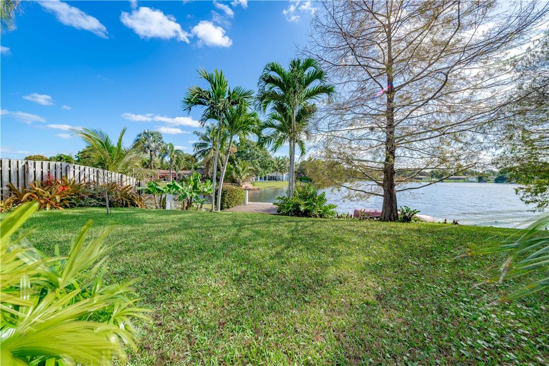 1920 Southwest 67th Terrace Plantation, FL 33317 - Photo 49 of 65 a view of a garden with a building in the background