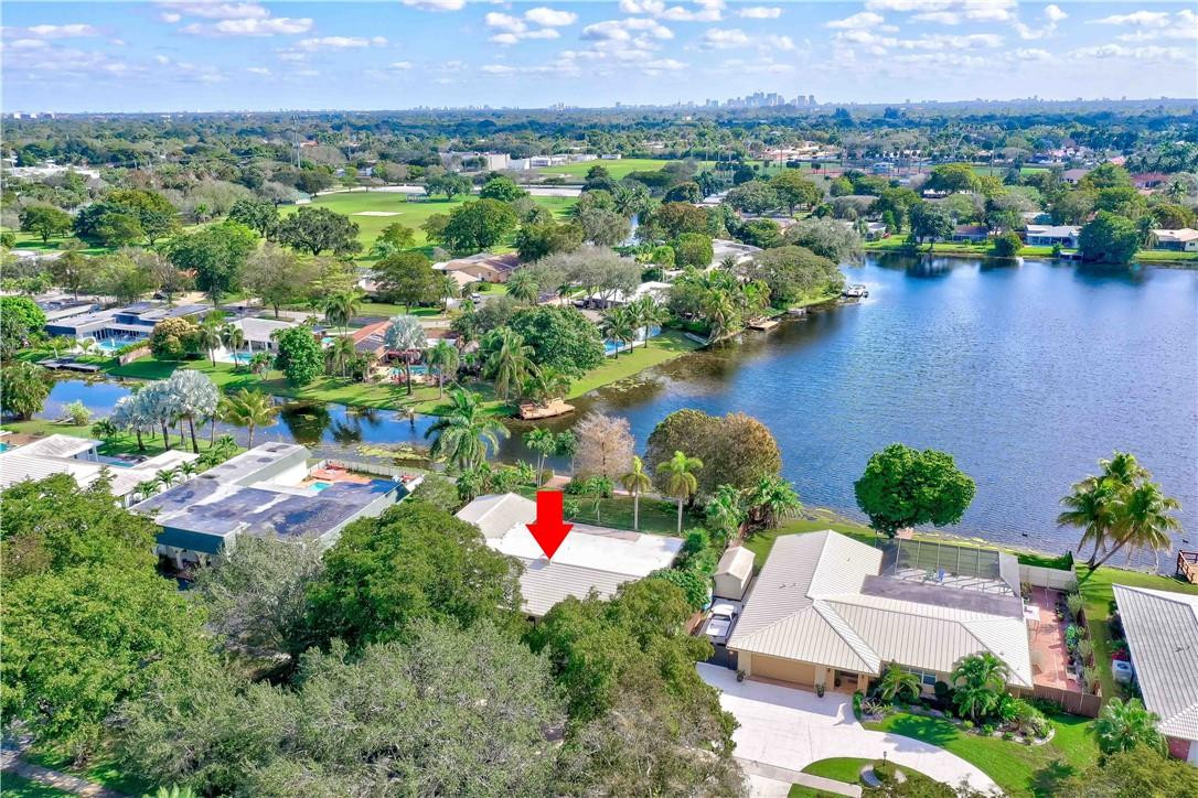 1920 Southwest 67th Terrace Plantation, FL 33317 - Photo 56 of 65 an aerial view of residential house with outdoor space and lake view