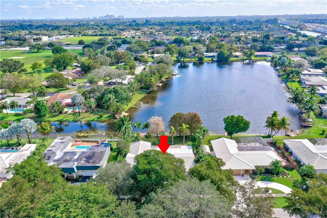 1920 Southwest 67th Terrace Plantation, FL 33317 - Photo 57 of 65 an aerial view of residential house with outdoor space and lake view