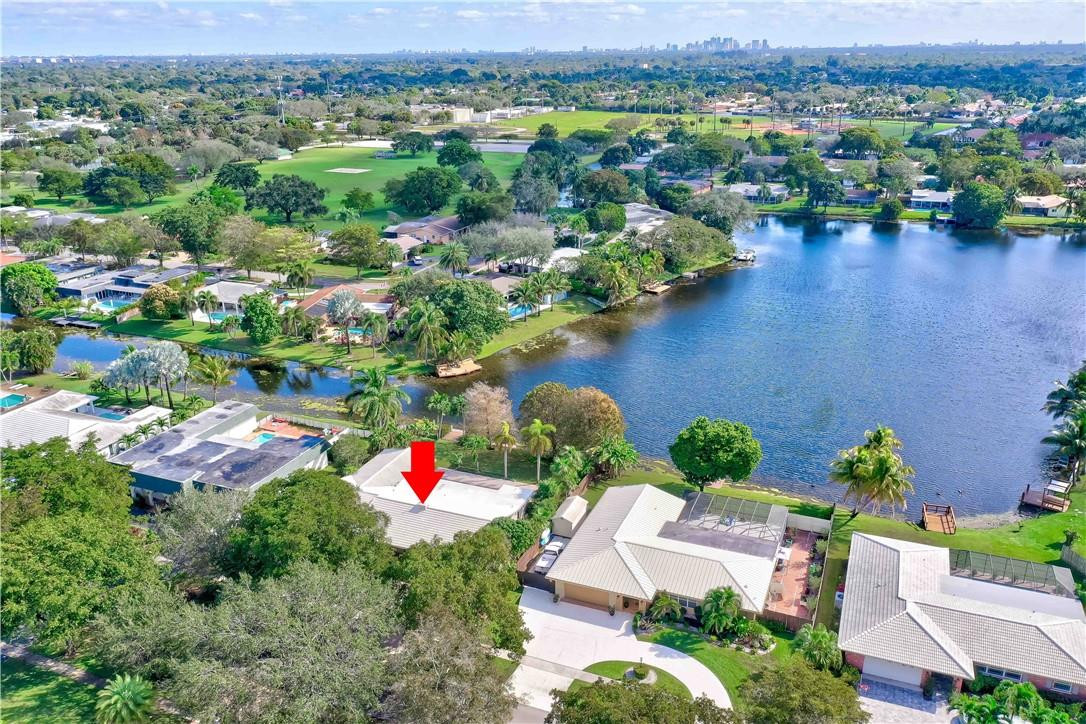 1920 Southwest 67th Terrace Plantation, FL 33317 - Photo 58 of 65 an aerial view of residential houses with outdoor space and lake view