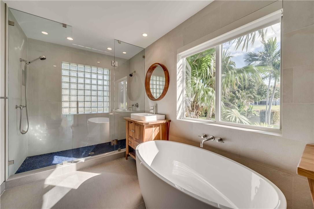 1920 Southwest 67th Terrace Plantation, FL 33317 - Photo 9 of 65 a spacious bathroom with a bathtub and a large window
