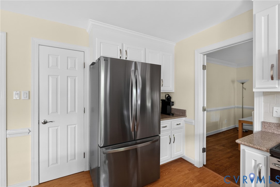 5710 Oak Knoll Road Midlothian, VA 23112 - Photo 23 of 66 The pantry is on the left. And the refrigerator c