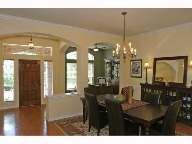 2750 Grimes Ranch Road Austin, TX 78732 - Photo 1 of 1 a view of a dining room with furniture and chandelier