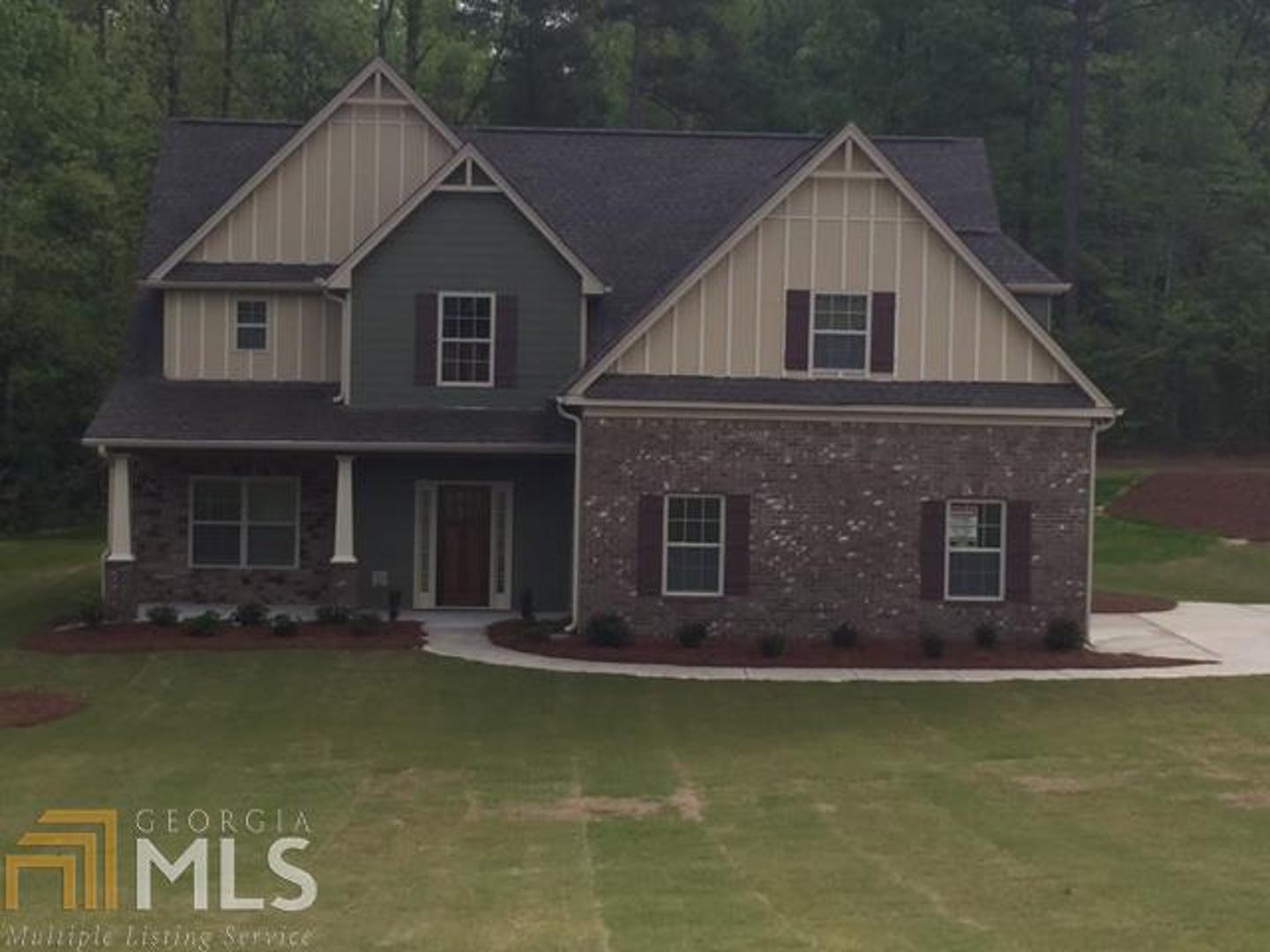 160 Caraway Road, Unit 66 & 67 Locust Grove, GA 30248 - Photo 1 of 1 a front view of a house with swimming pool