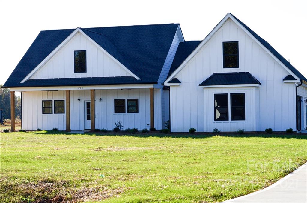 470 Cal Kennedy Road Cleveland, NC 27013 - Photo 21 of 21 a front view of house with yard and garage