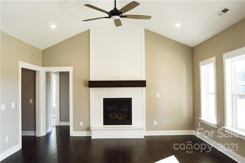470 Cal Kennedy Road Cleveland, NC 27013 - Photo 4 of 21 a view of an empty room with glass door and a window