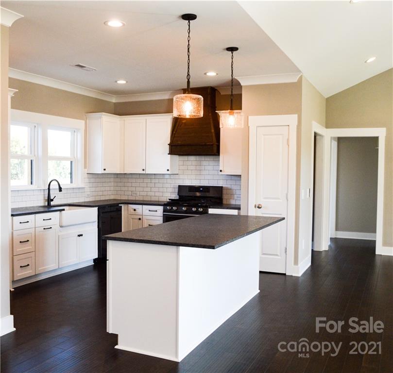 470 Cal Kennedy Road Cleveland, NC 27013 - Photo 7 of 21 a kitchen with a sink and a stove top oven