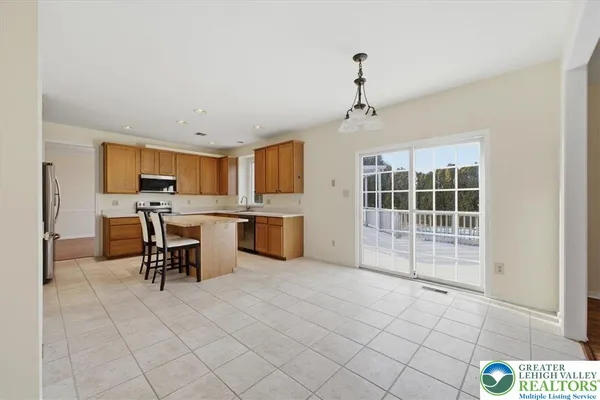a view of kitchen with furniture and window