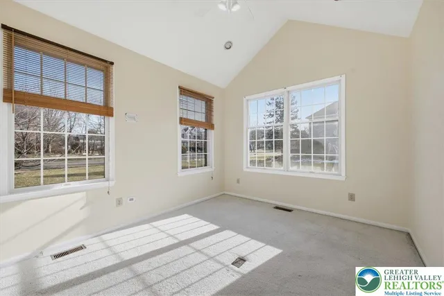 a view of an empty room with a window