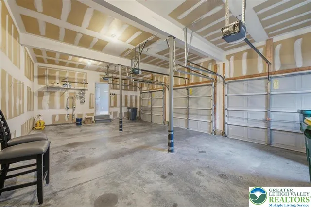 a view of an empty room with stairs