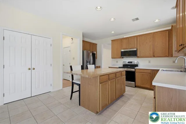 a kitchen with cabinets and appliances