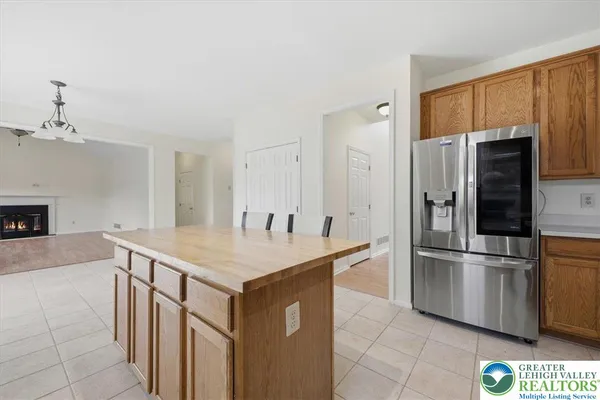 a kitchen with stainless steel appliances a refrigerator and a stove