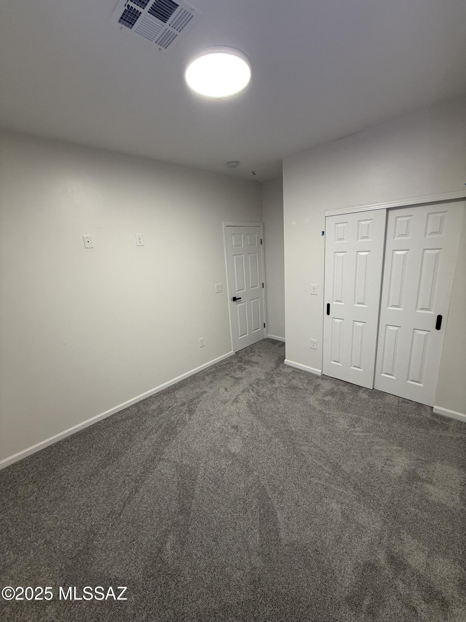 104 Escocia Court Rio Rico, AZ 85648 - Photo 8 of 10 a view of an empty room and a window