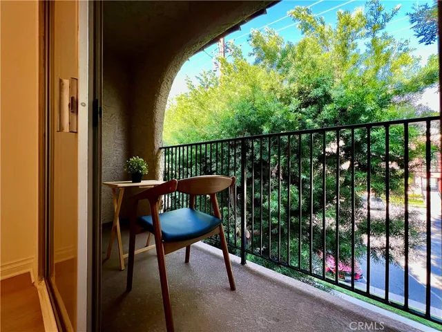 a view of balcony with furniture and wooden floor