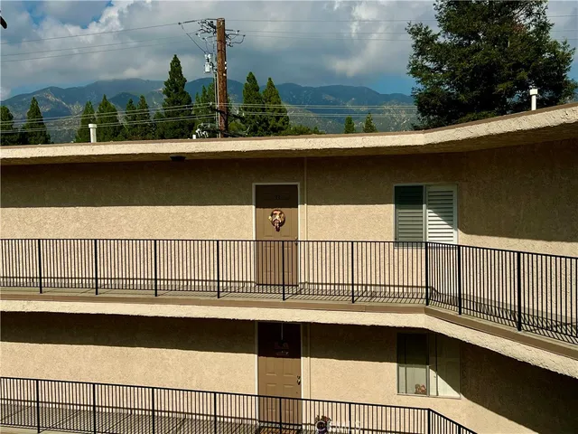 a view of a hallway with chandelier