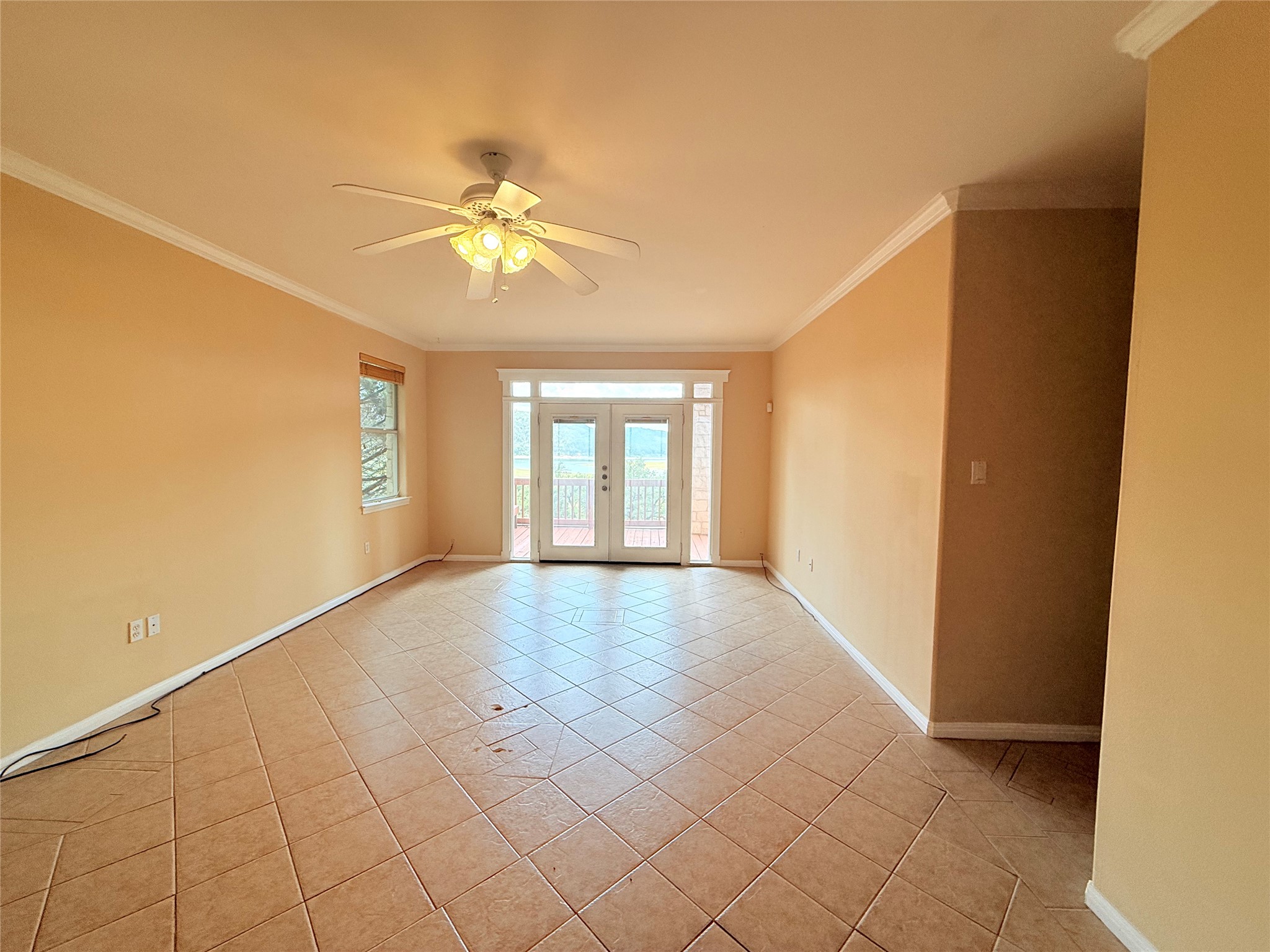 13612 Bullick Hollow Road Austin, TX 78726 - Photo 22 of 34 a view of an empty room with chandelier fan and fire place