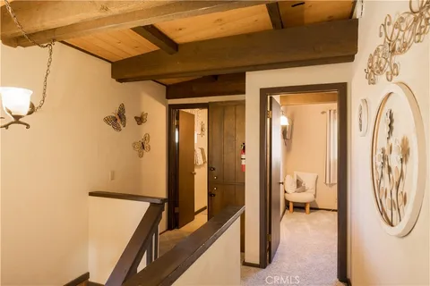 a view of a hallway with a washer and dryer