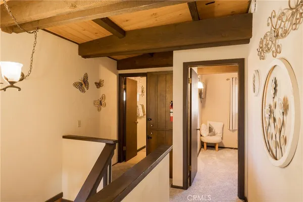 a view of a hallway with a washer and dryer