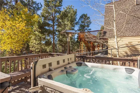 a view of a balcony with wooden fence