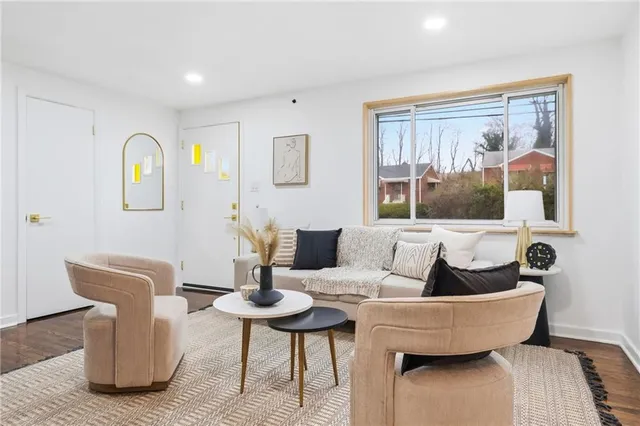 a living room with furniture and window