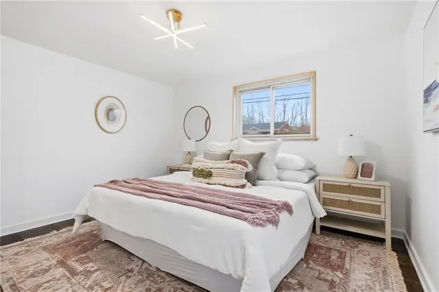 a bedroom with bed and a window