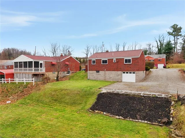 an aerial view of houses with yard