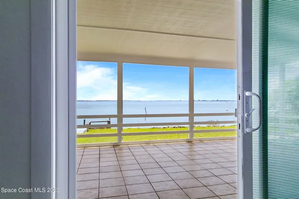 a view of empty room with stairs
