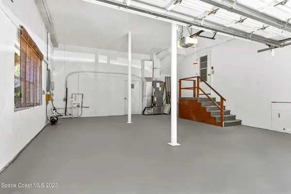 a view of a house with swimming pool and a yard