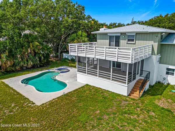 an aerial view of a house with a garden