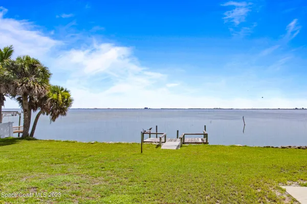 a view of a swimming pool with a lake view