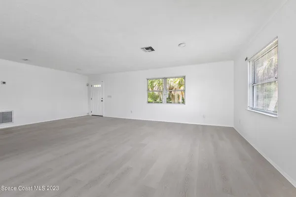 an empty room with windows