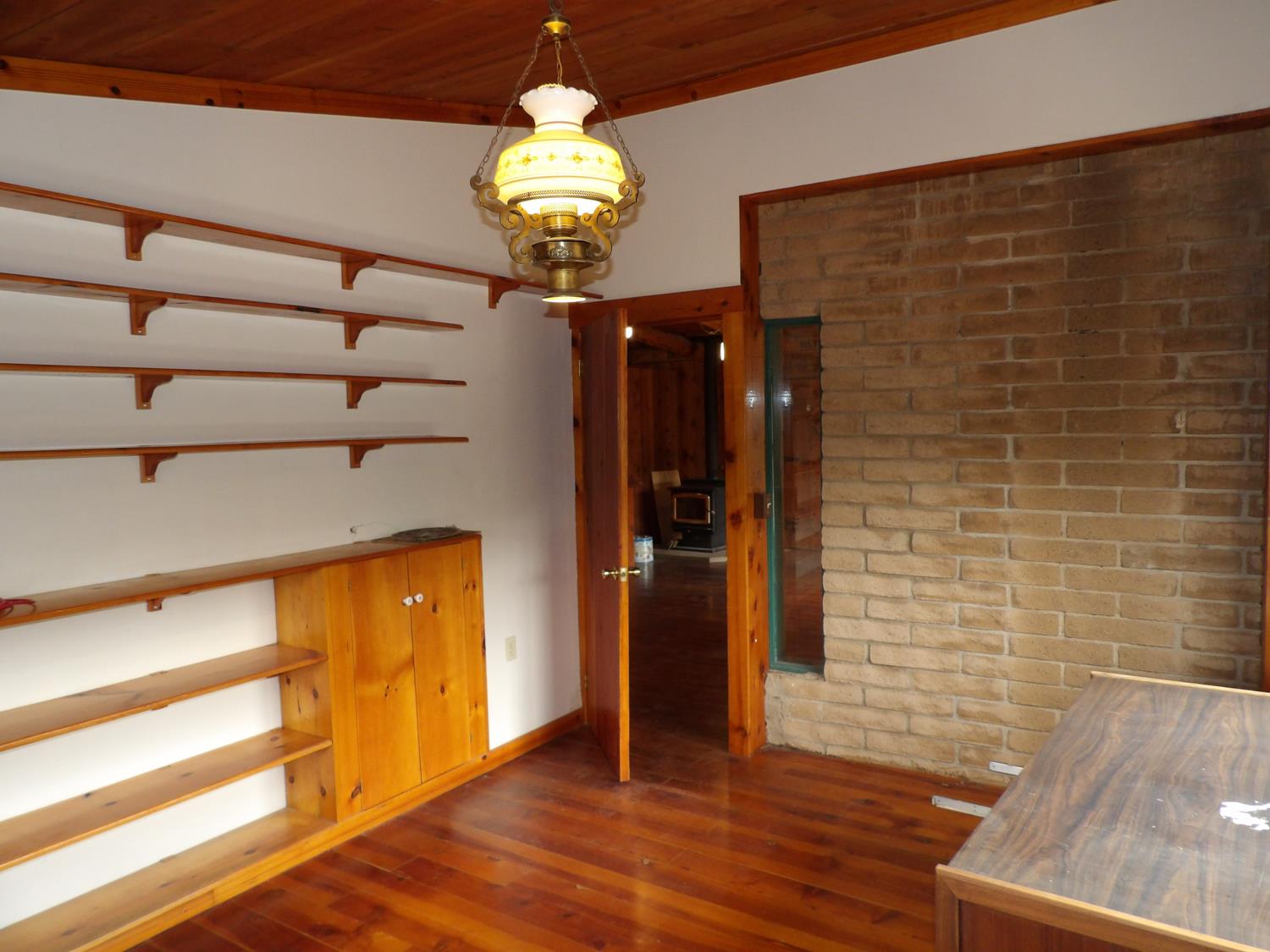 44001 Dunlap Road Miramonte, CA 93641 - Photo 28 of 91 a view of a hallway with wooden floor and chandelier