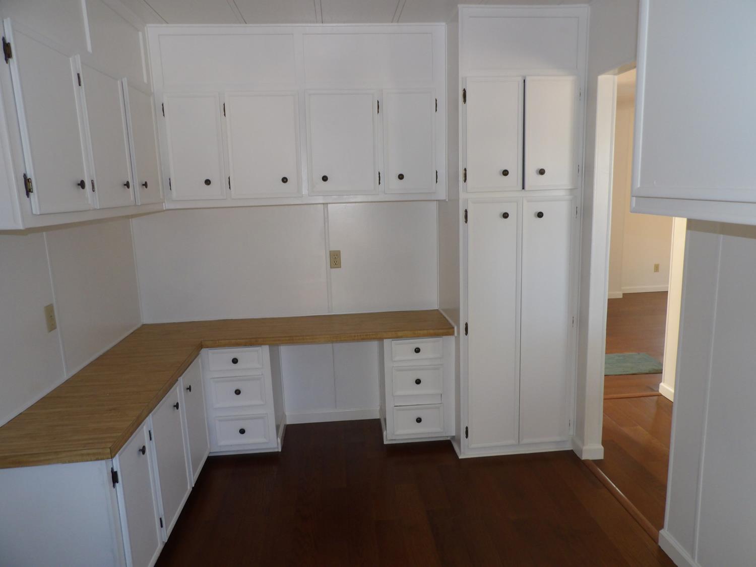 44001 Dunlap Road Miramonte, CA 93641 - Photo 49 of 91 a kitchen with white cabinets and a refrigerator