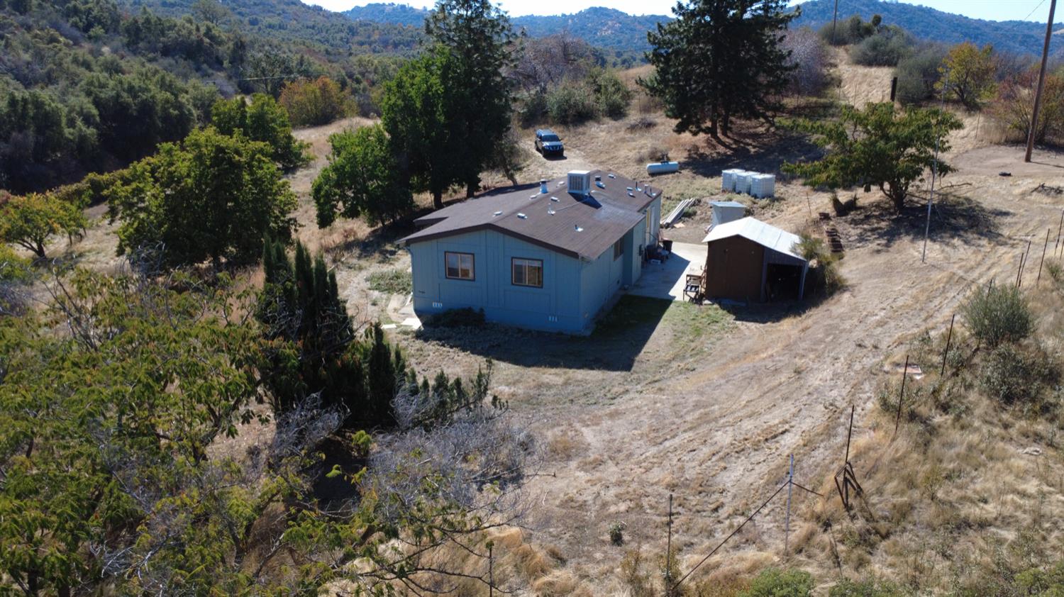 44001 Dunlap Road Miramonte, CA 93641 - Photo 53 of 91 a aerial view of a house with a yard and large trees